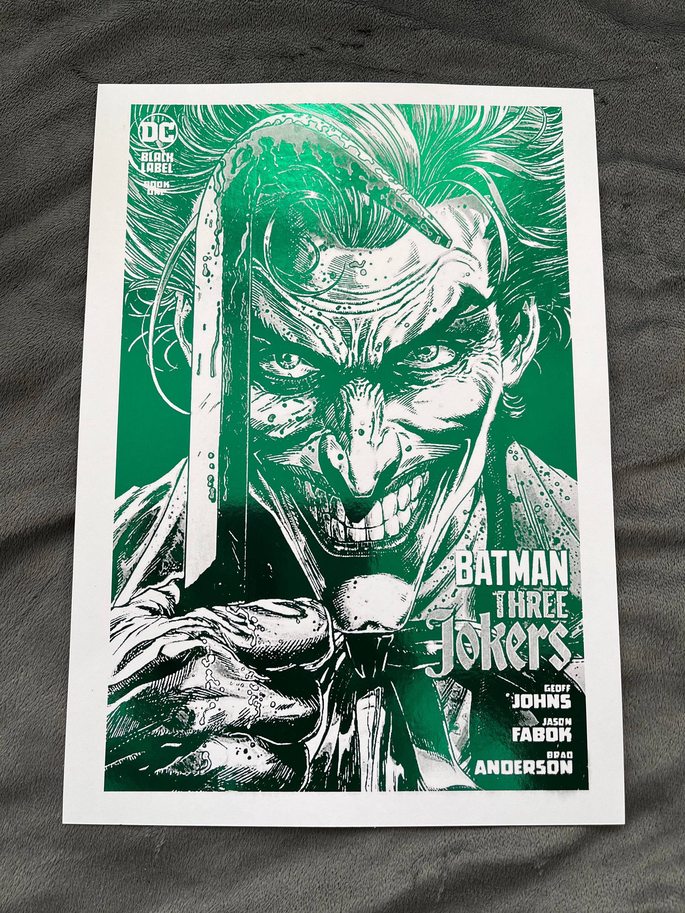 Vibrant green Joker foil print featuring the Clown Prince of Crime with an iconic smile.