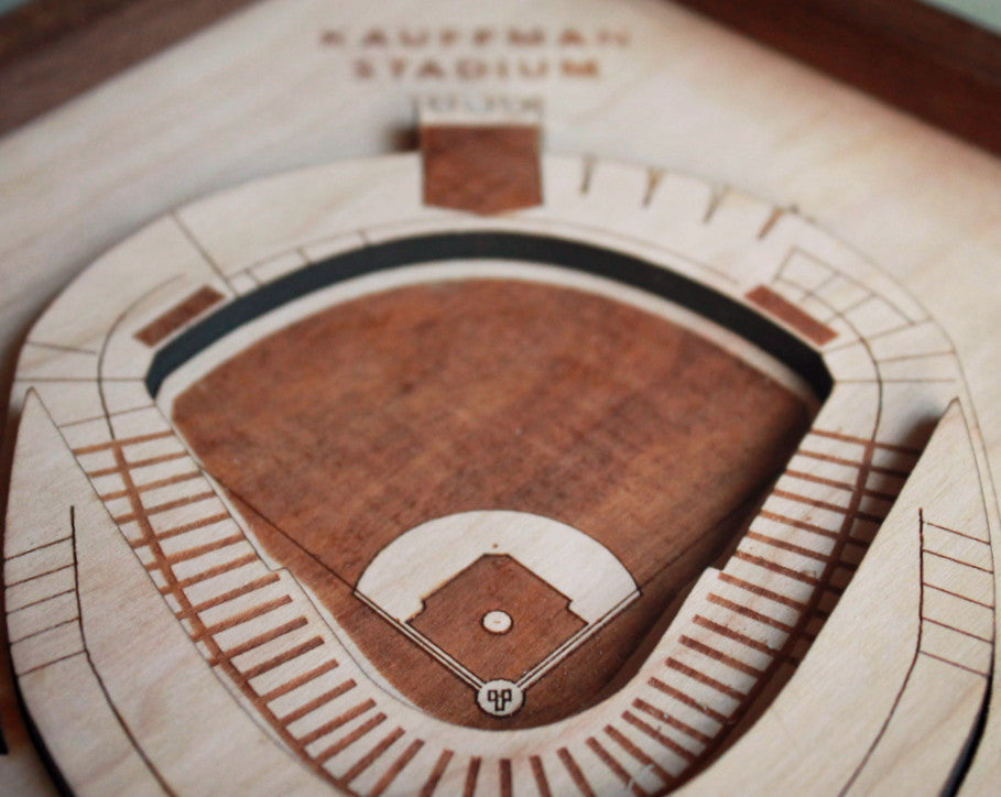 Intricate wooden art piece of Kauffman Stadium featuring detailed scoreboard and laser-etched fountains, framed in black walnut.