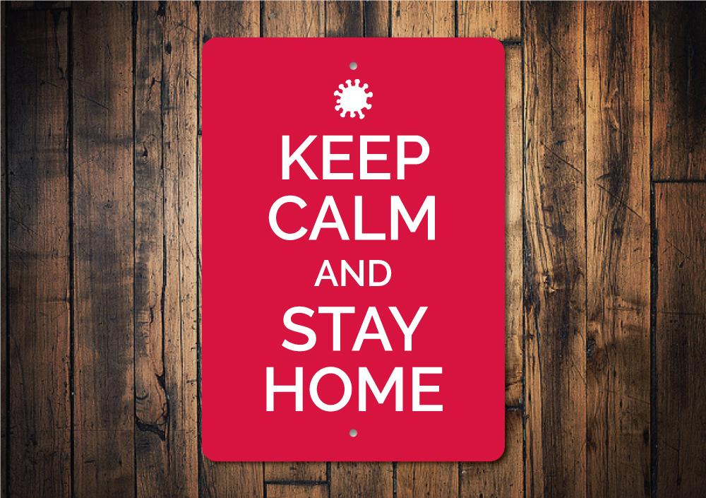 A decorative Keep Calm and Stay Home Sign made of aluminum, featuring a stylish design suitable for home decor.