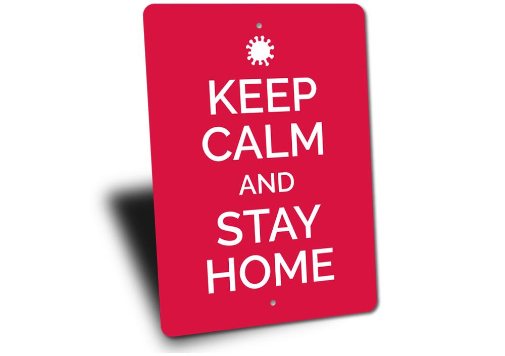 A decorative Keep Calm and Stay Home Sign made of aluminum, featuring a stylish design suitable for home decor.