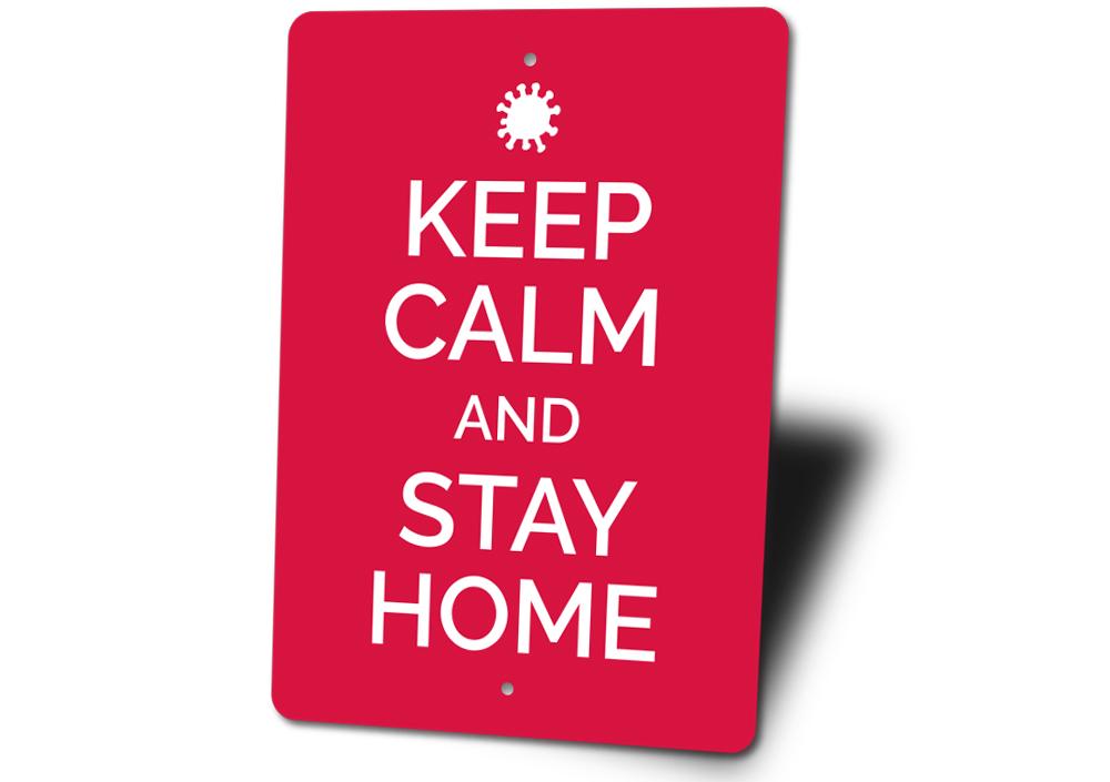 A decorative Keep Calm and Stay Home Sign made of aluminum, featuring a stylish design suitable for home decor.