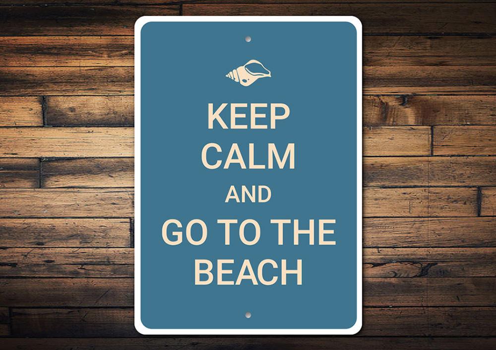 A decorative Keep Calm Beach Sign made of high-quality aluminum, featuring a beach-themed design perfect for coastal decor.