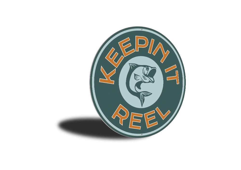 Keepin it Reel Sign made of high-quality aluminum, showcasing a lake theme, perfect for lakehouses and outdoor decor.