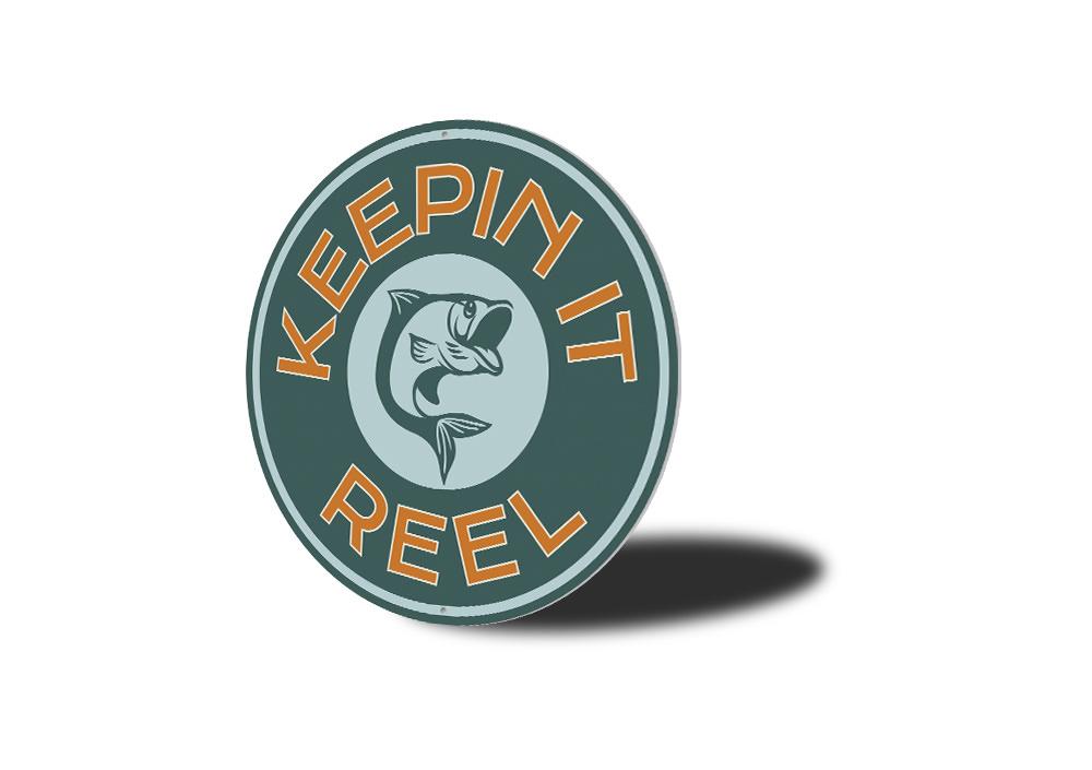 Keepin it Reel Sign made of high-quality aluminum, showcasing a lake theme, perfect for lakehouses and outdoor decor.