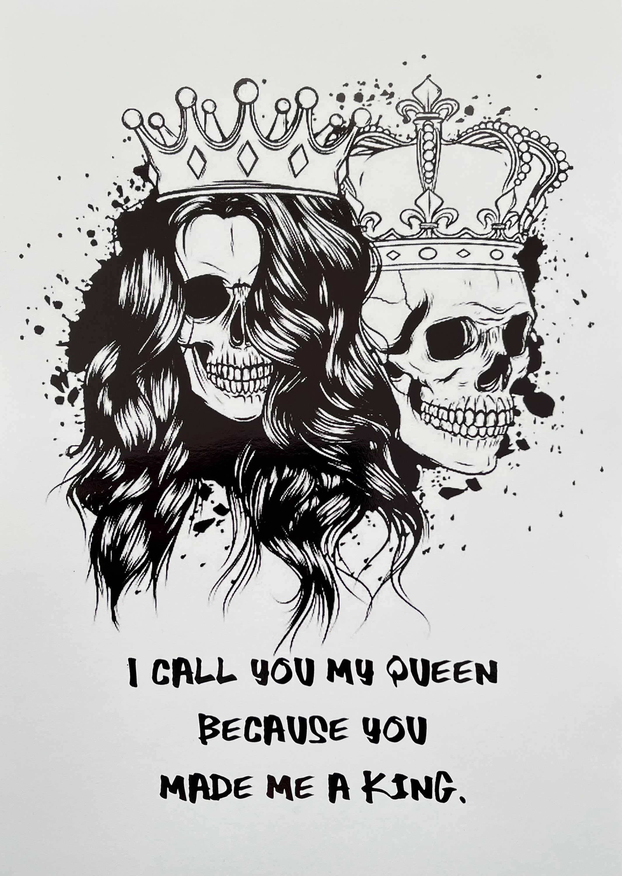 King & Queen Skull Foil Print featuring male and female skulls with crowns, showcasing intricate black foil details.