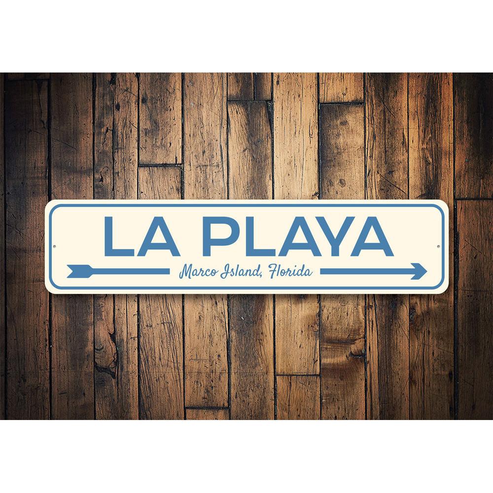 La Playa Beach Sign made of durable aluminum, featuring vibrant colors and a coastal design, perfect for home decor.