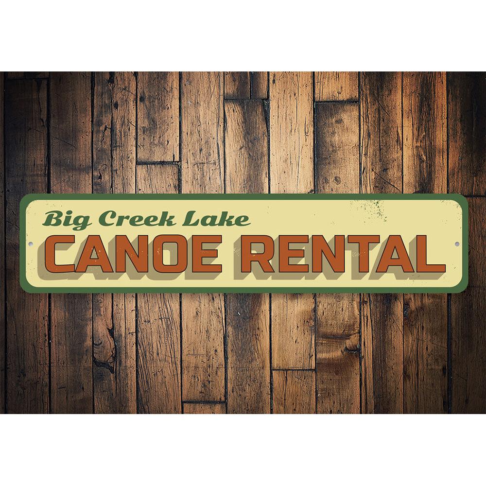 A decorative Lake Canoe Rental Sign made of high-quality aluminum, featuring customizable text and pre-drilled holes for easy mounting.