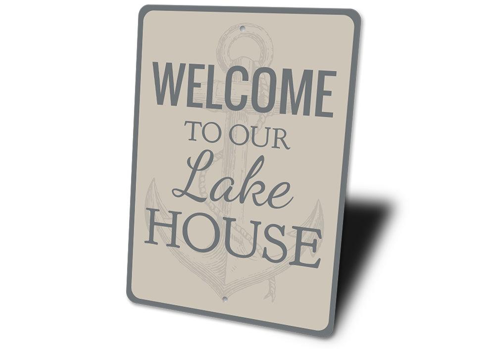 A beautifully crafted Lake House Anchor Sign made of durable aluminum, featuring a nautical design perfect for lake house decor.