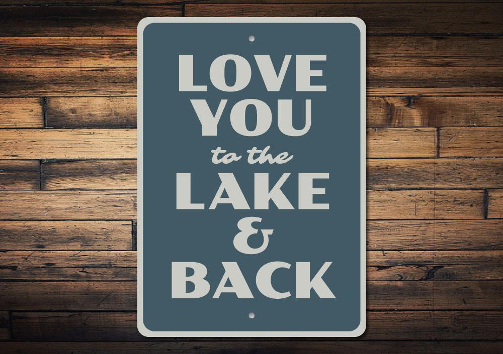 A beautifully crafted Lake Love Sign made of high-quality aluminum, showcasing a rustic design perfect for lakehouses.