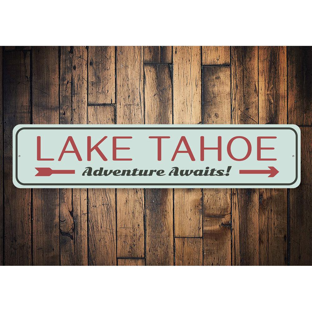 A beautiful Lake Tahoe Awaits Sign made of high-quality aluminum, showcasing a scenic lake design, perfect for home decor.