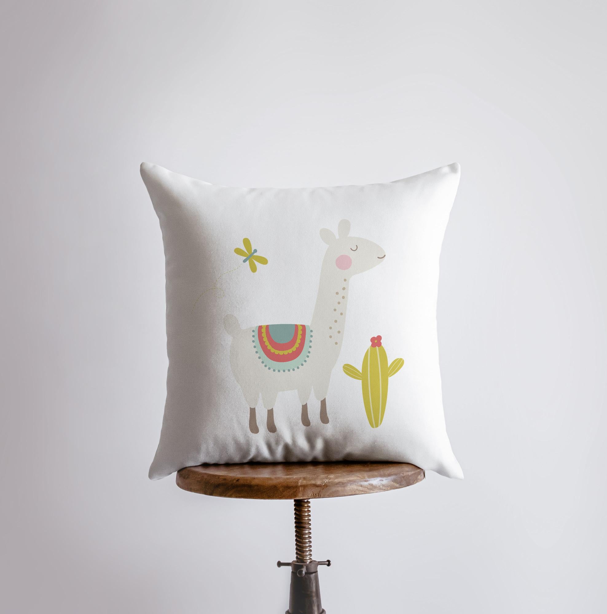 A charming llama pillow featuring a lime green cactus design, handmade in America, showcasing a cute llama on the front and a white back.