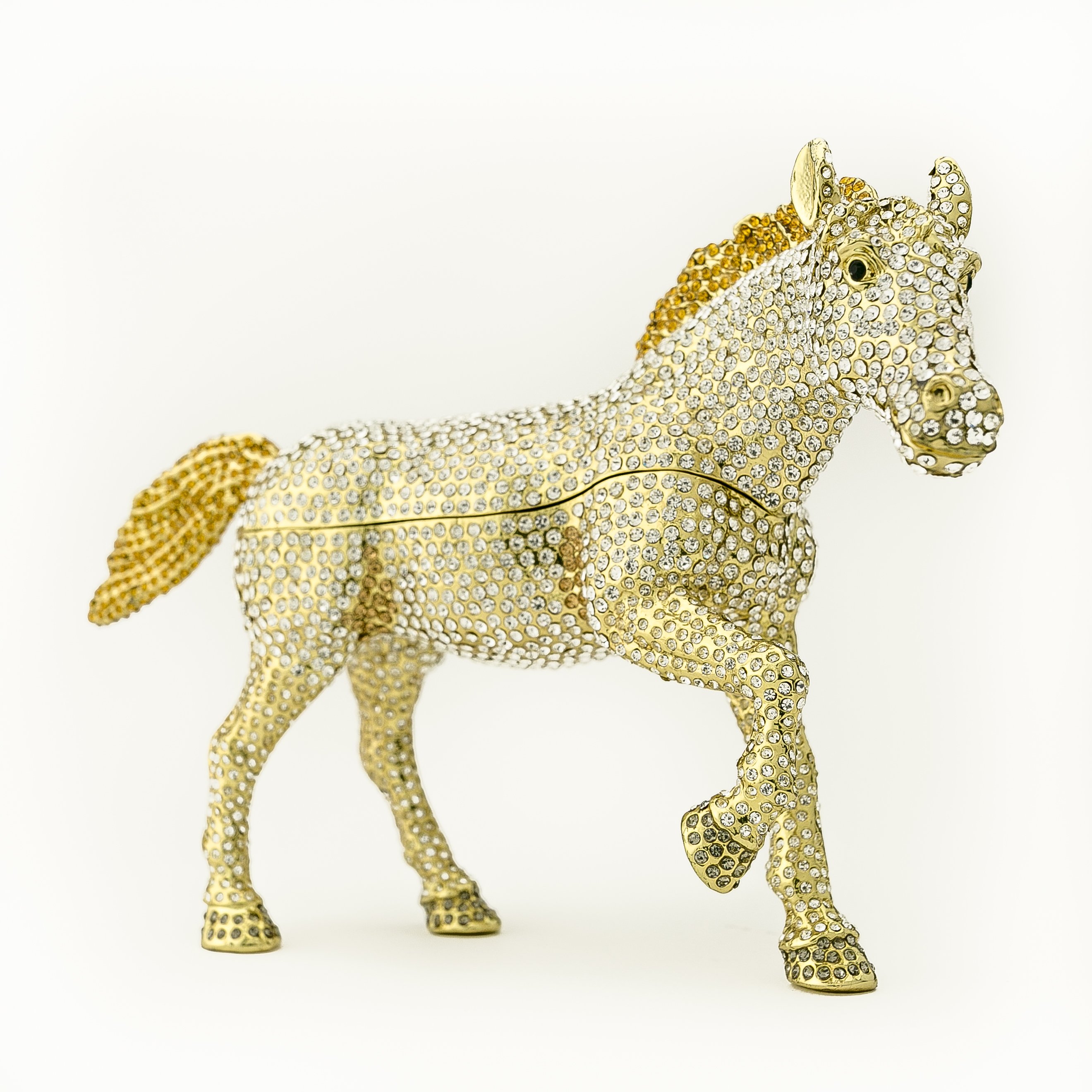 Large golden horse trinket box adorned with white Austrian crystals, showcasing intricate enamel painting and luxurious gold plating.