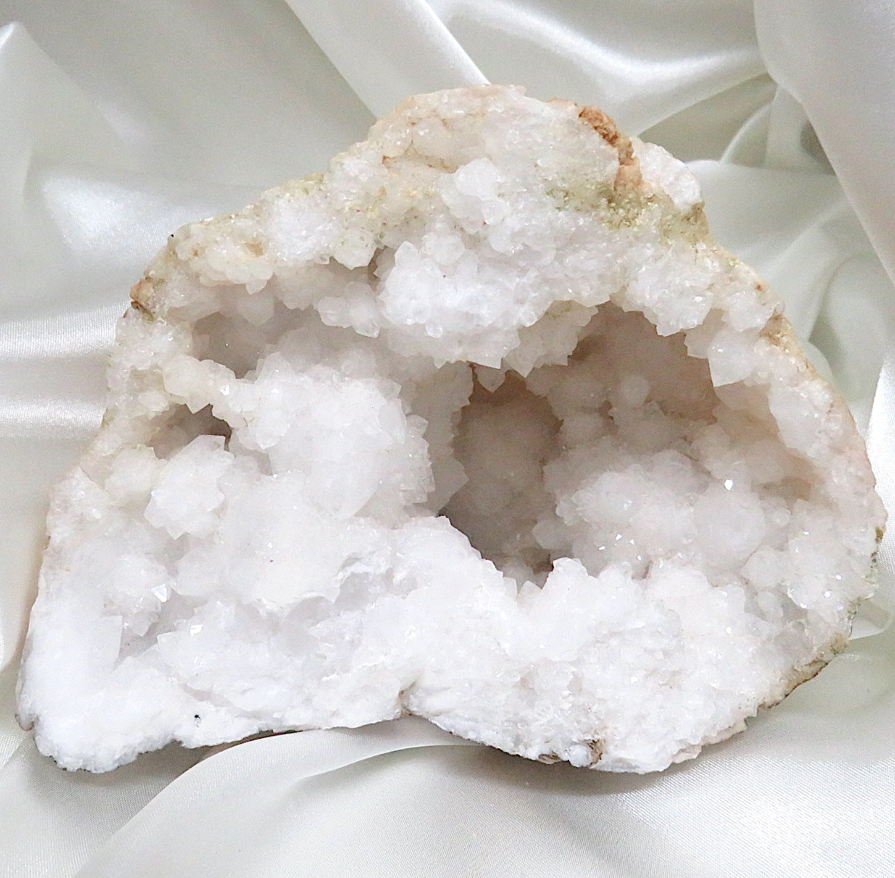 A stunning Large Quartz Sugar Geode showcasing sparkling druzy quartz crystals inside a rough exterior, perfect for energy amplification and spiritual growth.