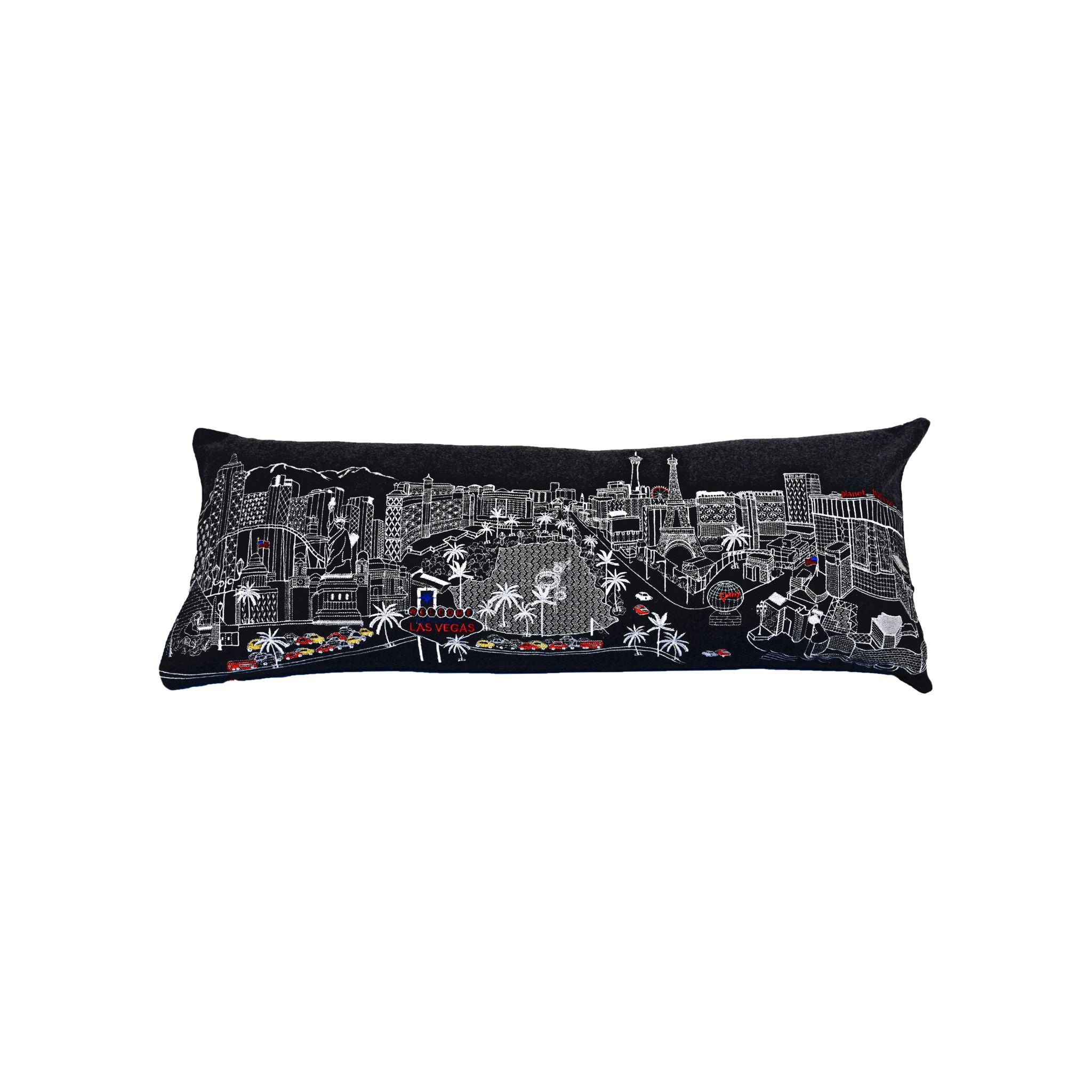 Las Vegas Pillow featuring embroidered city landmarks and a red zipper, showcasing vibrant colors and quality fabric.