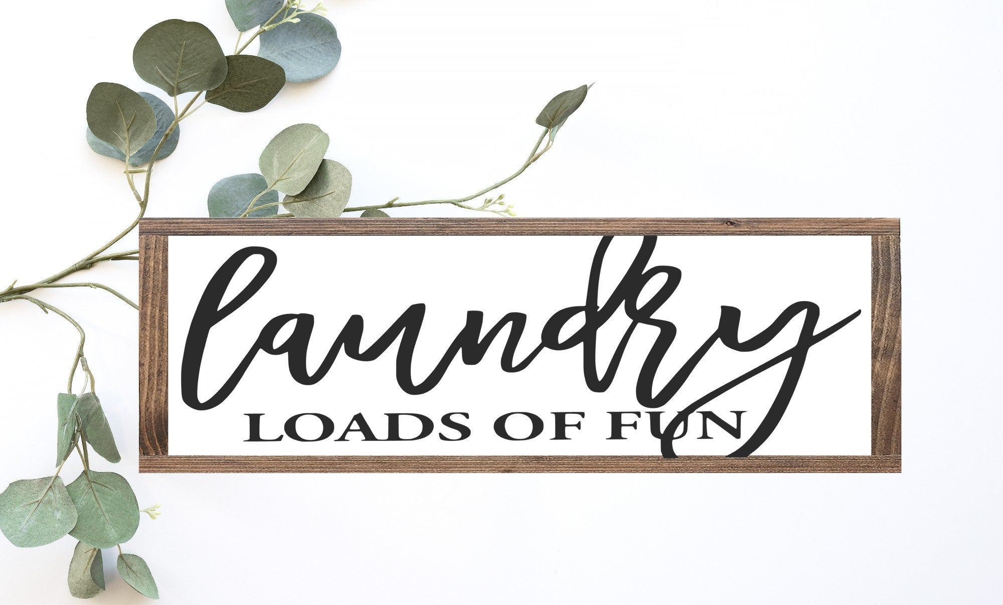 Laundry Loads Of Fun Wood Sign in matte white finish, showcasing unique wood grain and lettering.