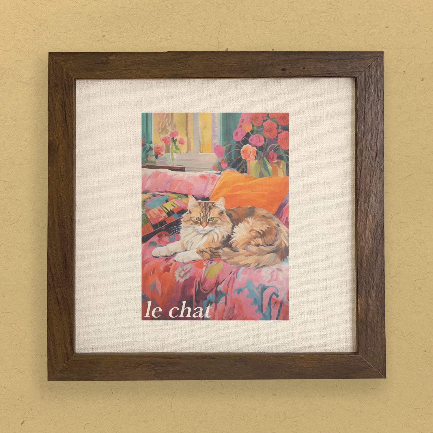 Le Chat framed sign featuring a stylized wood frame with a linen-look background, available in walnut or white-washed finishes.