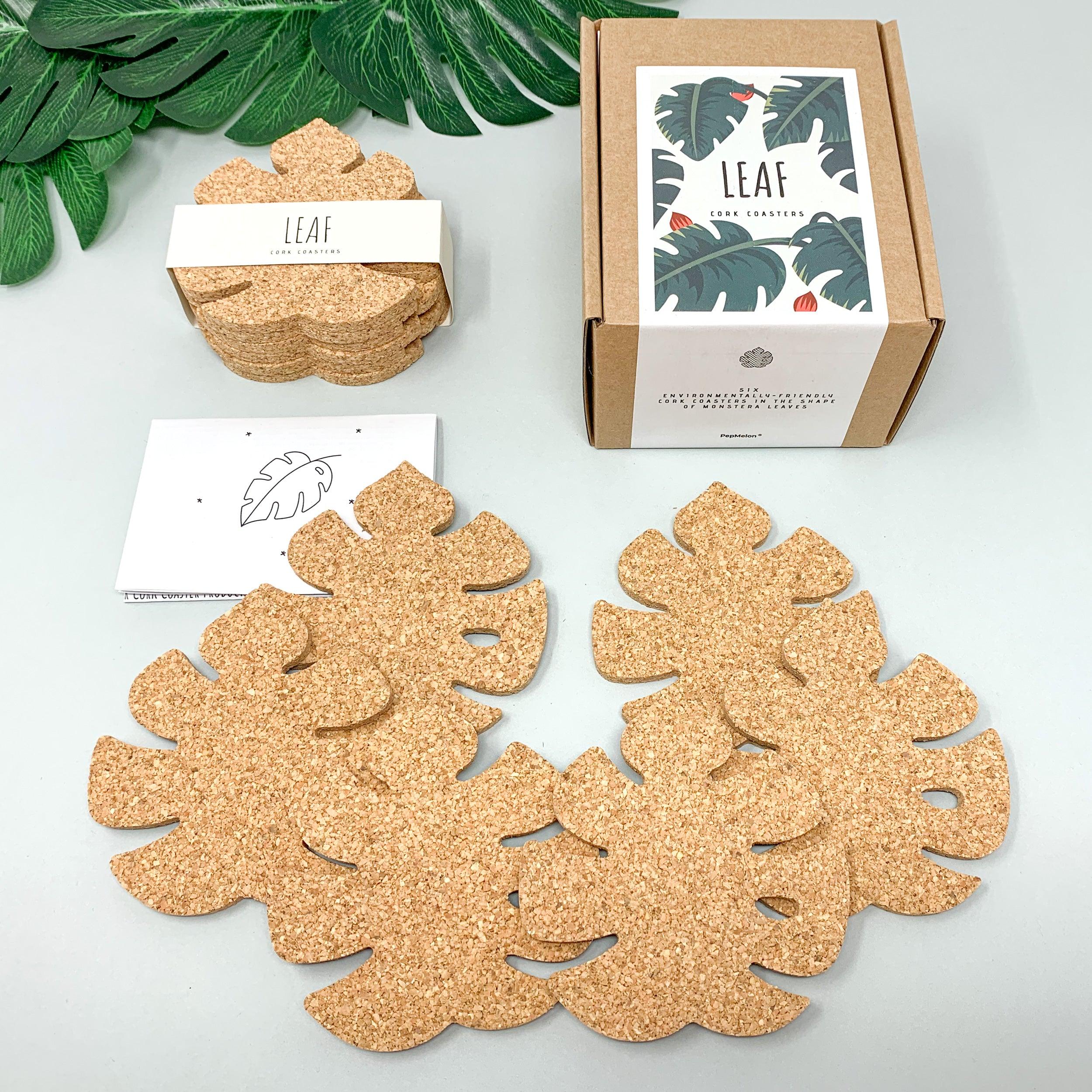 Set of six Monstera leaf shaped cork coasters, eco-friendly and stylish for home decor.