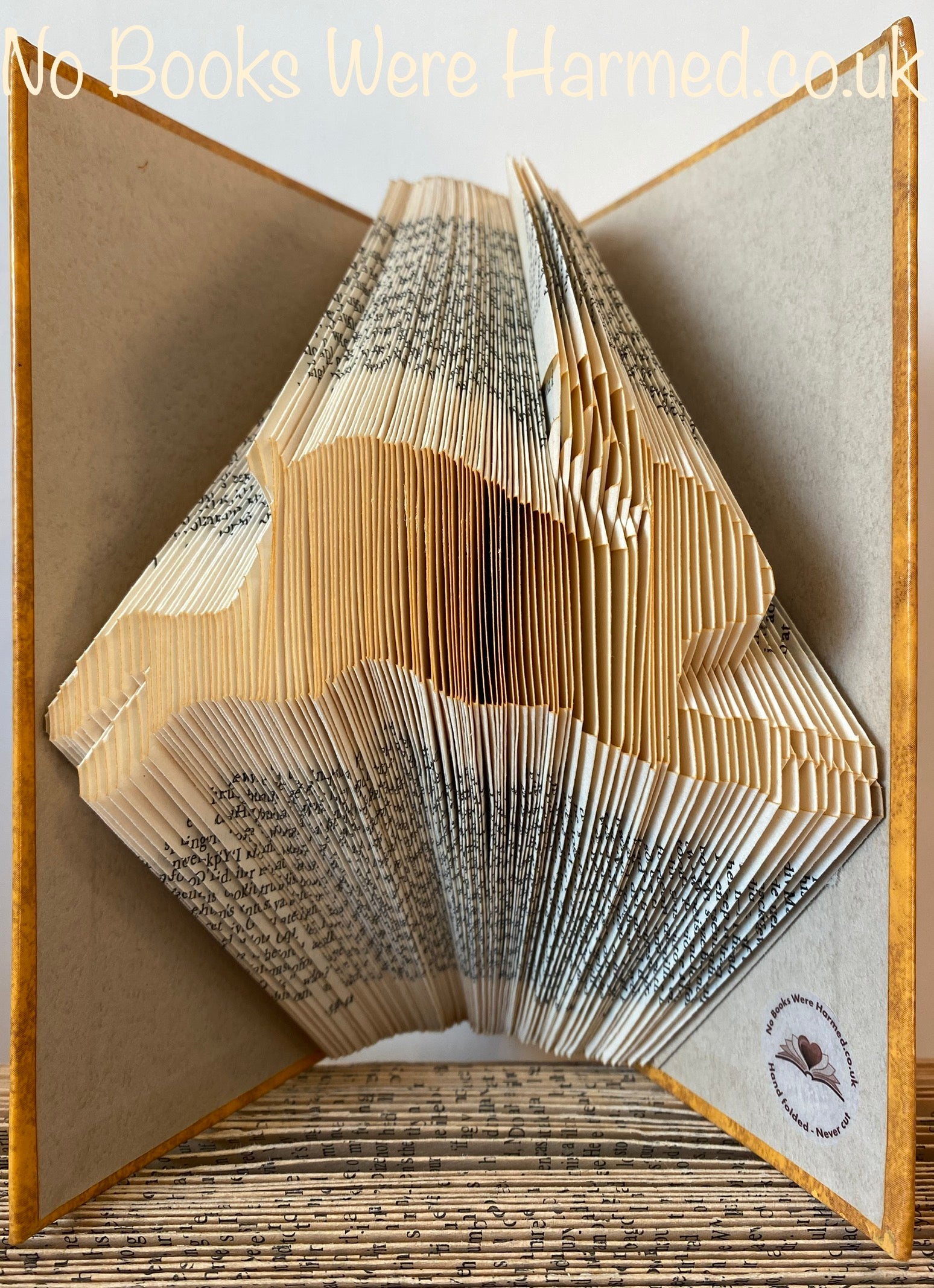 Handcrafted Leaping Hare or Rabbit art made from vintage book pages, showcasing intricate folds and unique design.