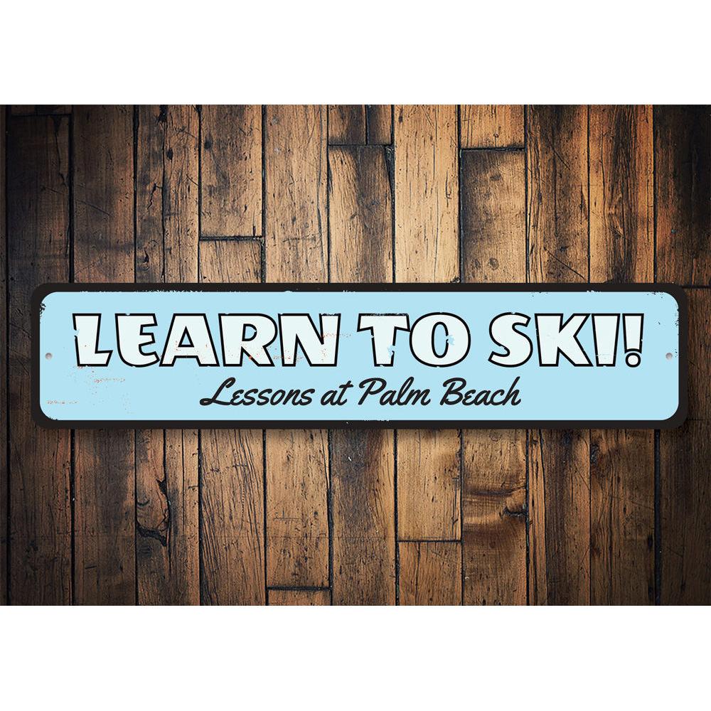 Customizable Learn To Ski Sign made from high-quality aluminum, featuring pre-drilled holes for easy mounting.