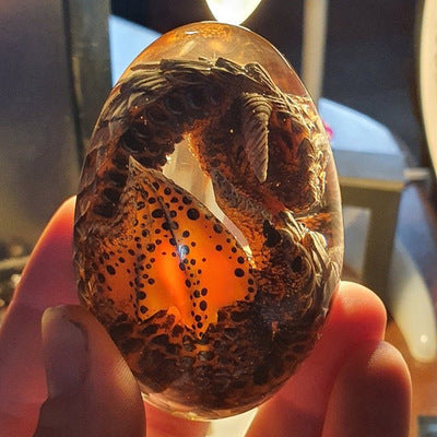 LED Lava Dragon Egg ornamental decor featuring a transparent design with a lava dragon inside, crafted from high-quality synthetic resin.