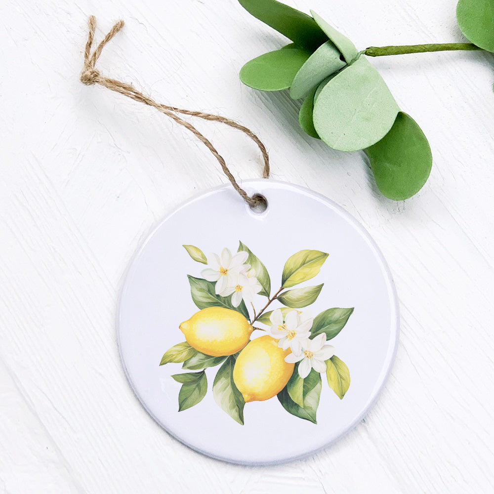 Lemon and Blooms porcelain ornament featuring original design, 2.75 inches in diameter.