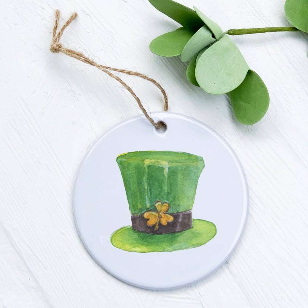 A vibrant porcelain ornament shaped like a leprechaun hat, featuring intricate designs and a smooth gloss finish.