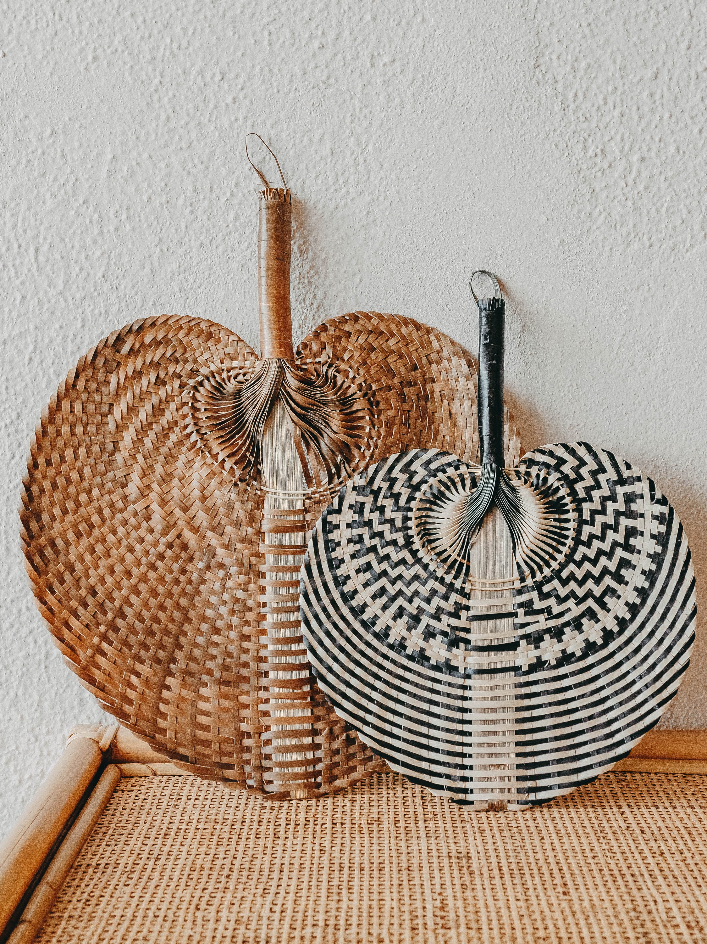 Handcrafted Leque Natural fan in brown color, perfect for home decor.