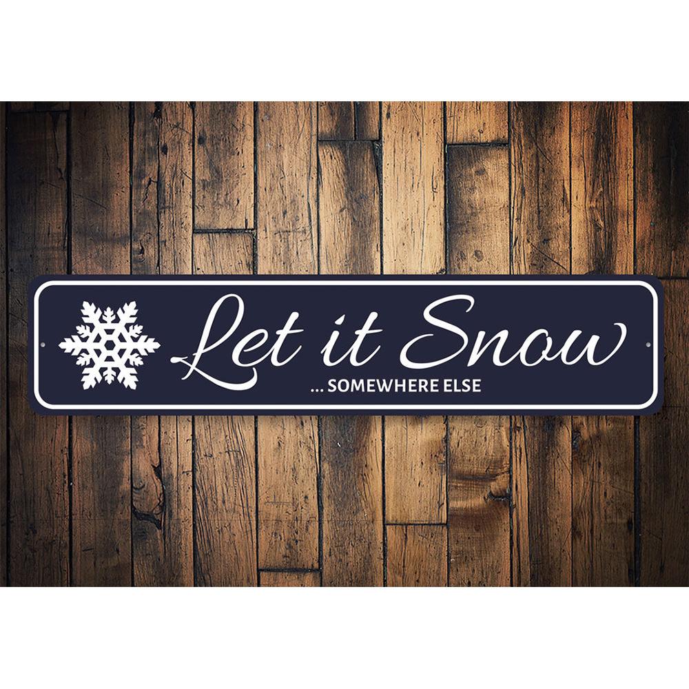 Let It Snow Somewhere Else Holiday Sign made of durable aluminum, featuring festive design perfect for Christmas decorations.