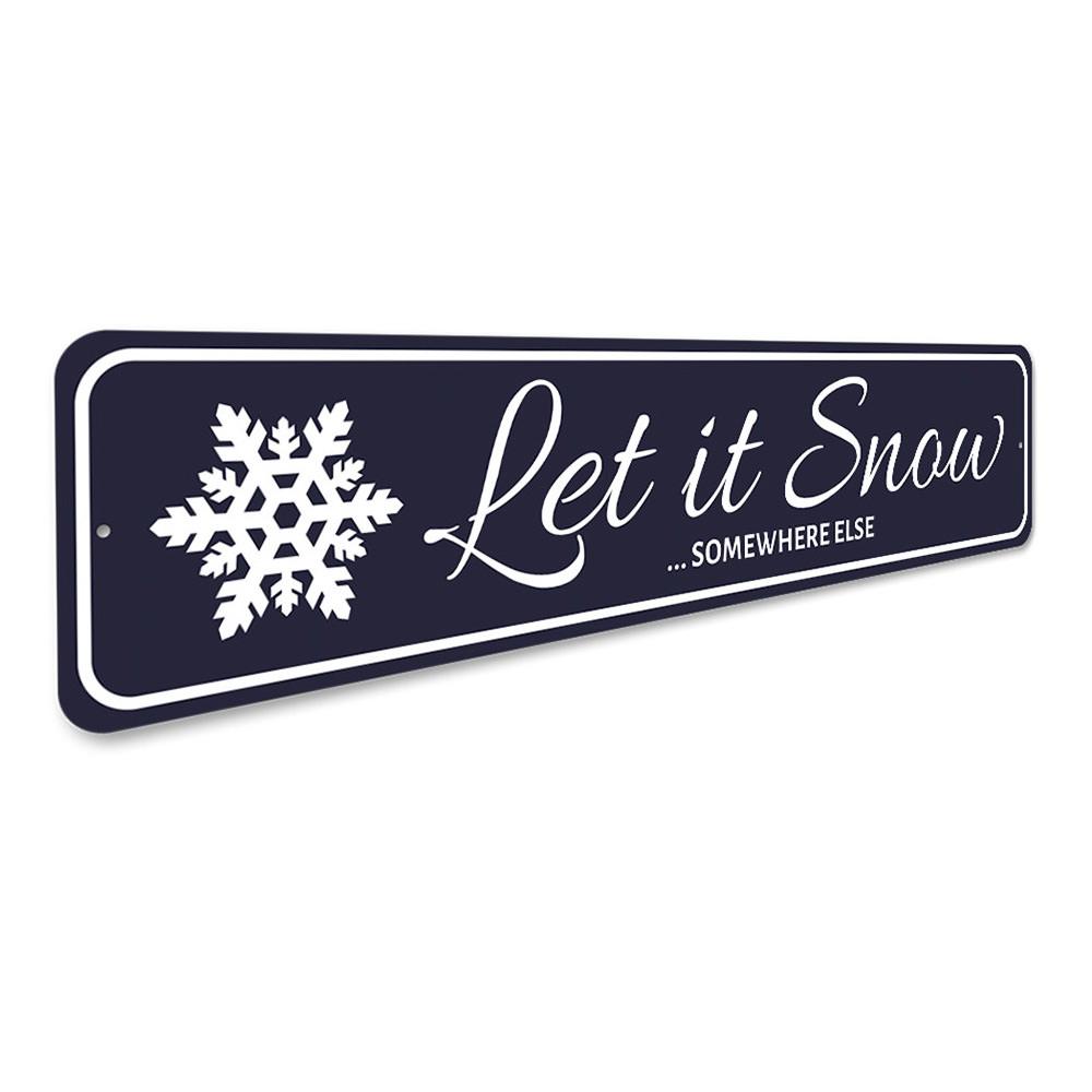 Let It Snow Somewhere Else Holiday Sign made of durable aluminum, featuring festive design perfect for Christmas decorations.