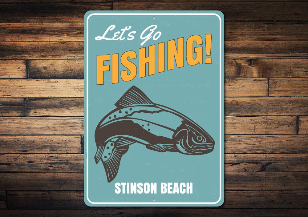 A decorative Let's Go Fishing location sign made of high-quality aluminum, featuring a vibrant design perfect for lakehouses.