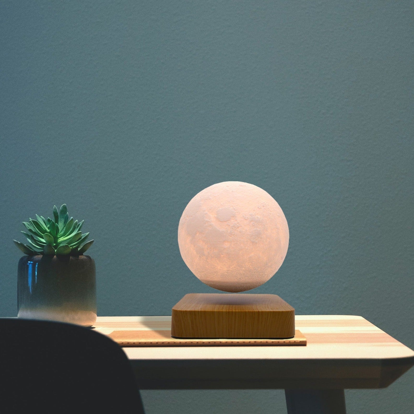 Levitation Moon Lamp showcasing its 3D printed design and magnetic levitation feature, floating in mid-air with a soft glow.