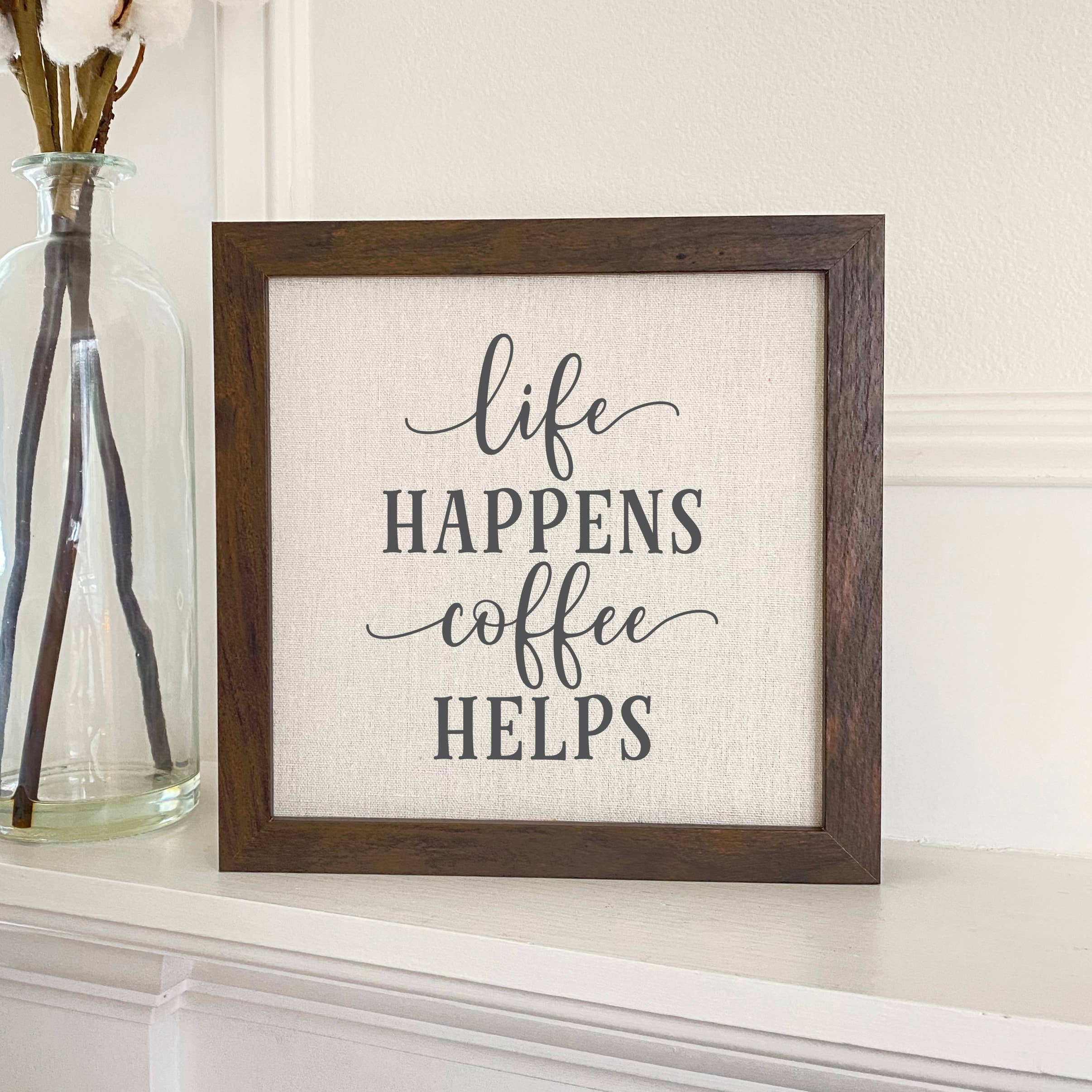 Life Happens Coffee Helps framed sign with a wood frame and linen-look background, perfect for home decor.