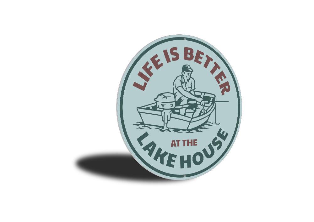 A decorative metal sign reading 'Life is Better at the Lake House', showcasing a beautiful lakeside theme, perfect for home decor.