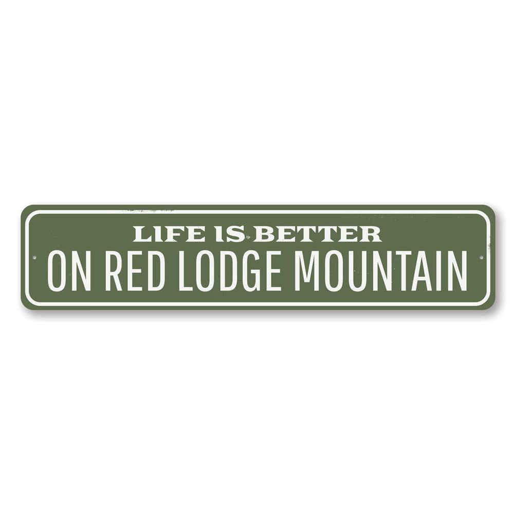 A decorative metal sign reading 'Life is Better at the Lodge', showcasing a rustic design perfect for lakehouses.