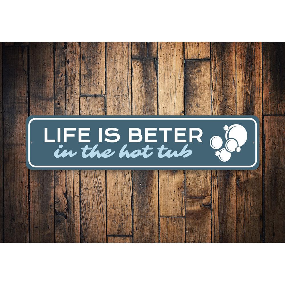 A decorative metal sign reading 'Life is Better in the Hot Tub', showcasing vibrant colors and quality aluminum material, perfect for home decor.