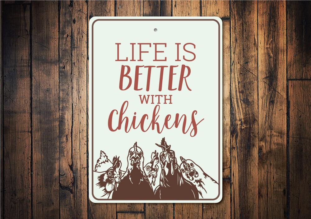 A decorative metal sign reading 'Life is Better with Chickens', showcasing vibrant colors and a charming design, perfect for home decor.