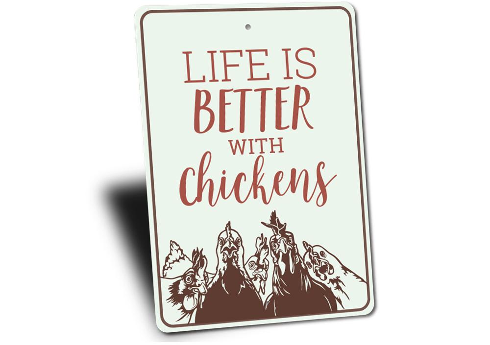 A decorative metal sign reading 'Life is Better with Chickens', showcasing vibrant colors and a charming design, perfect for home decor.