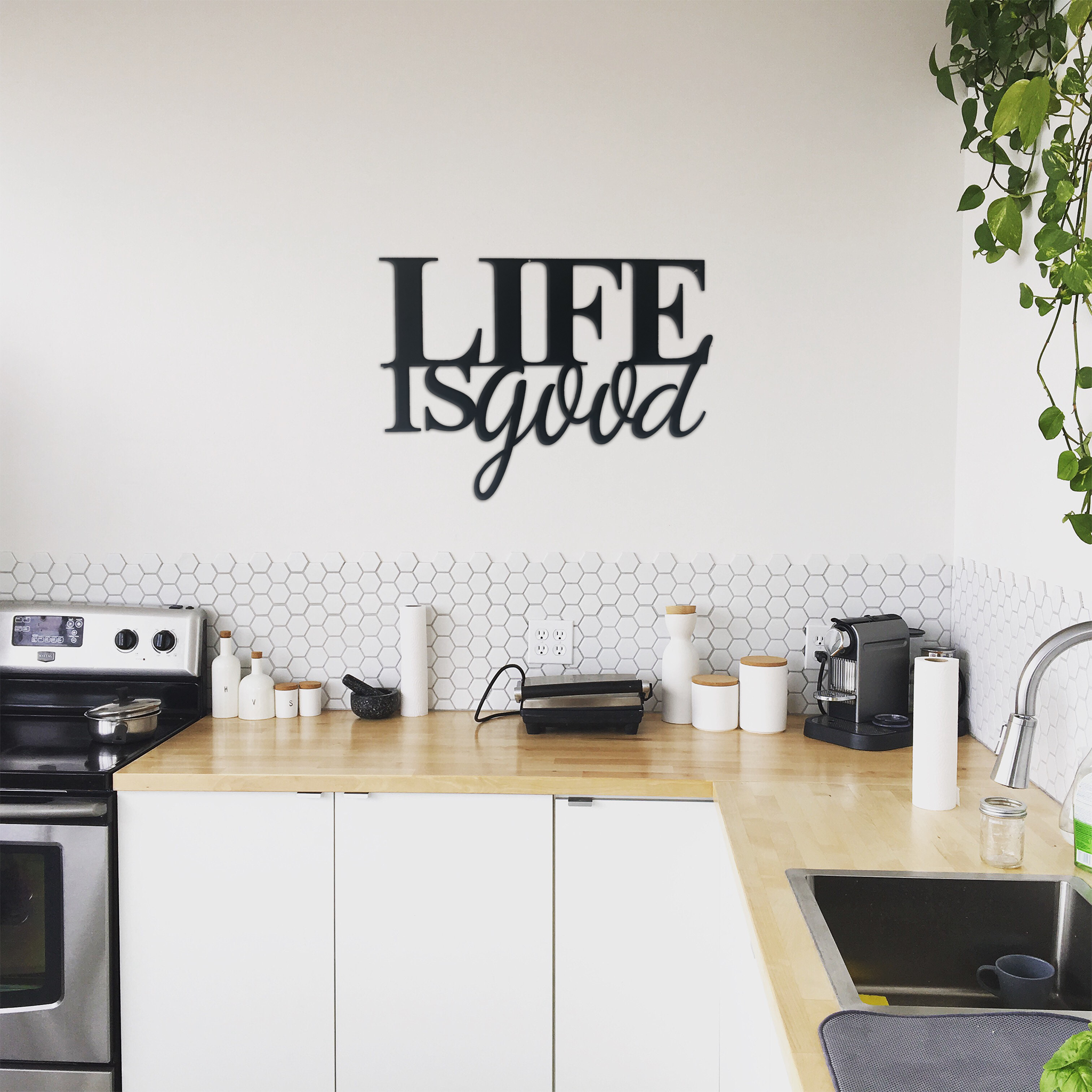 Life is Good Metal Wall Art in low gloss black finish, measuring 22 inches wide and 16 inches tall, perfect for home decor.