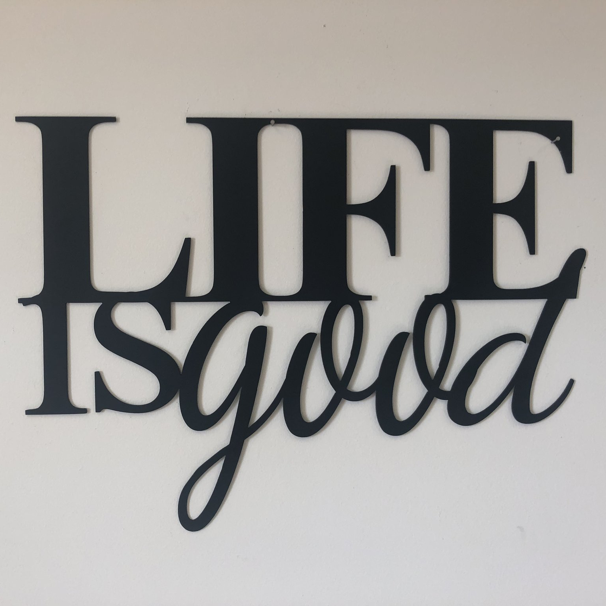 Life is Good Metal Wall Art in low gloss black finish, measuring 22 inches wide and 16 inches tall, perfect for home decor.