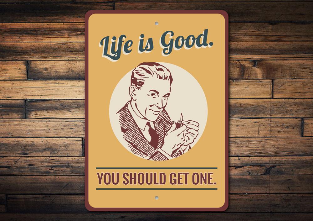 Decorative 'Life is Good You Should Get One' sign made of aluminum, featuring vibrant colors and a cheerful design, perfect for home decor.