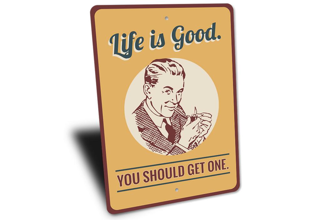 Decorative 'Life is Good You Should Get One' sign made of aluminum, featuring vibrant colors and a cheerful design, perfect for home decor.