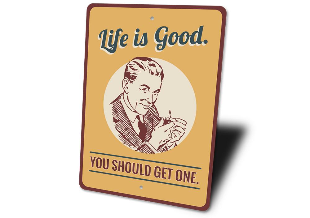 Decorative 'Life is Good You Should Get One' sign made of aluminum, featuring vibrant colors and a cheerful design, perfect for home decor.