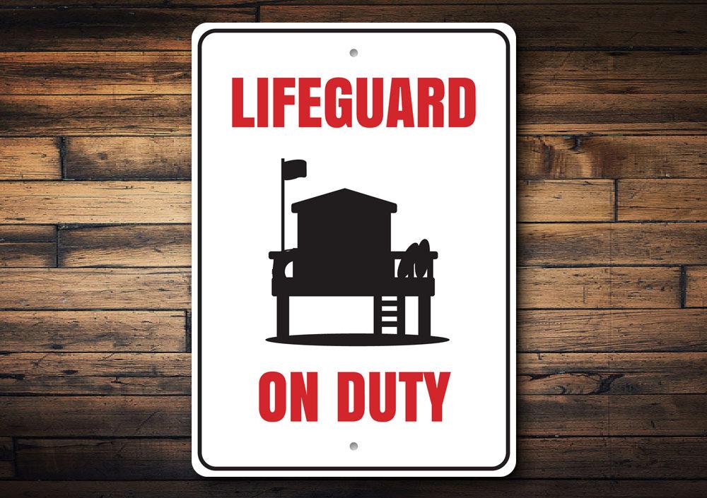 Lifeguard on Duty sign made of high-quality aluminum, featuring vibrant colors and a beach-themed design, perfect for coastal decor.