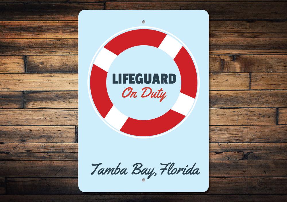 A decorative Lifeguard Sign made of high-quality aluminum, featuring customizable text, perfect for beach houses and coastal decor.