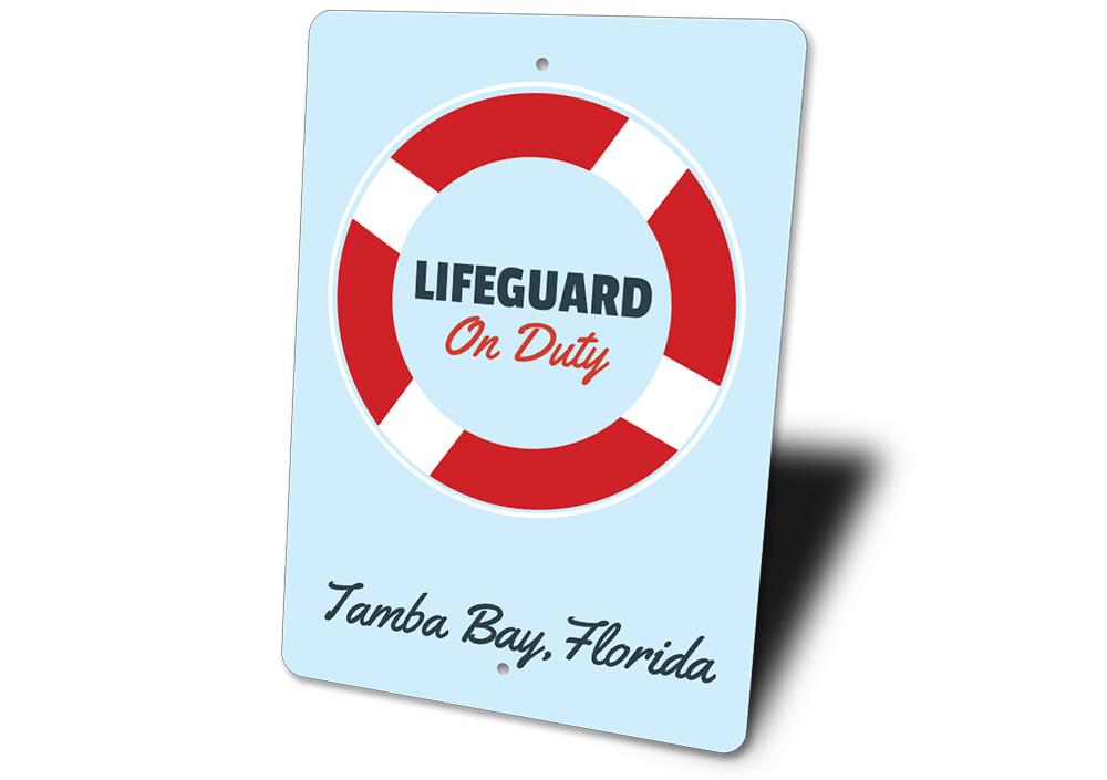 A decorative Lifeguard Sign made of high-quality aluminum, featuring customizable text, perfect for beach houses and coastal decor.