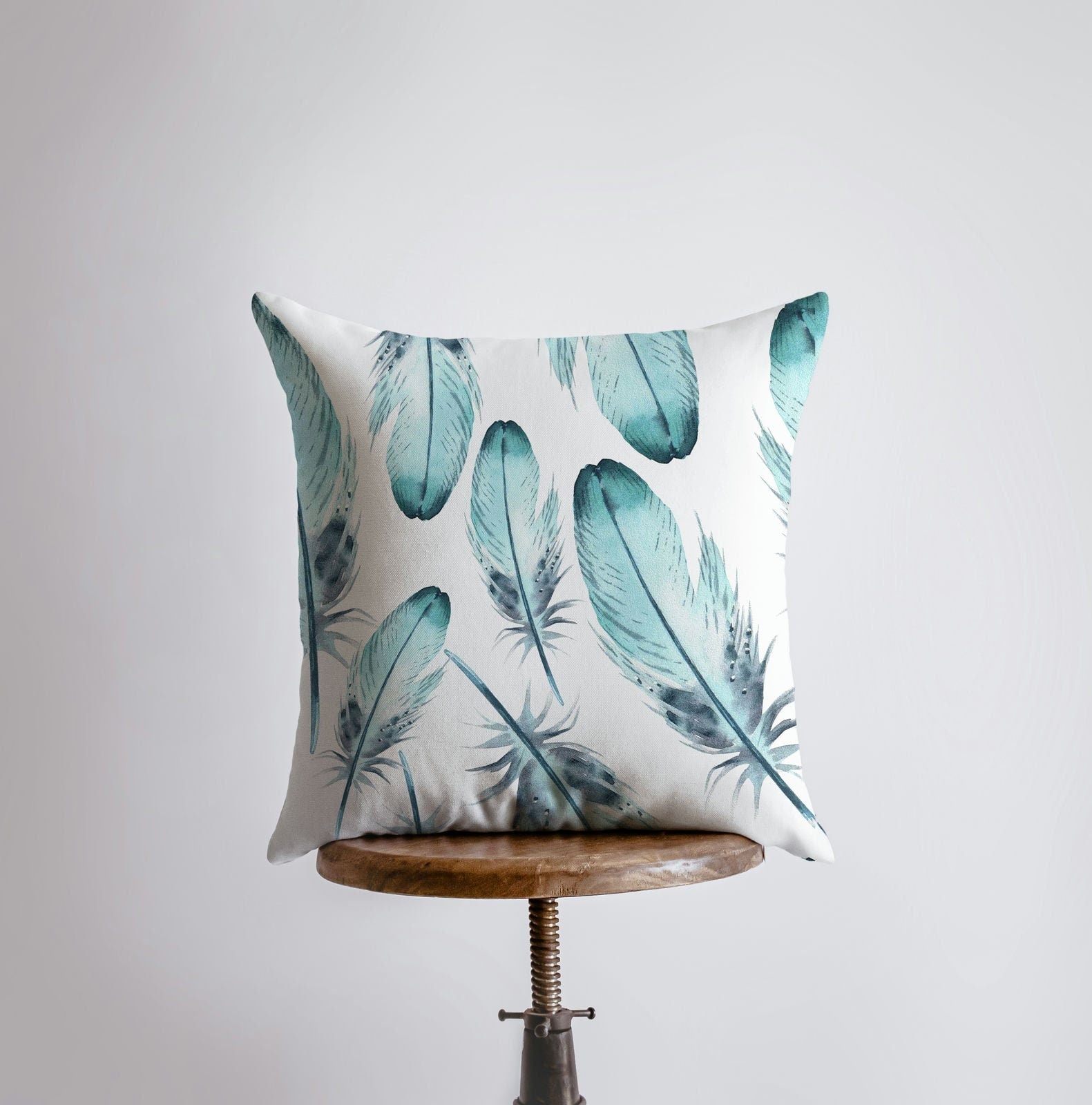 Light Blue Feathers Pillow Cover featuring a blue feather pattern on the front and a double-sided print on the back, handcrafted in America.