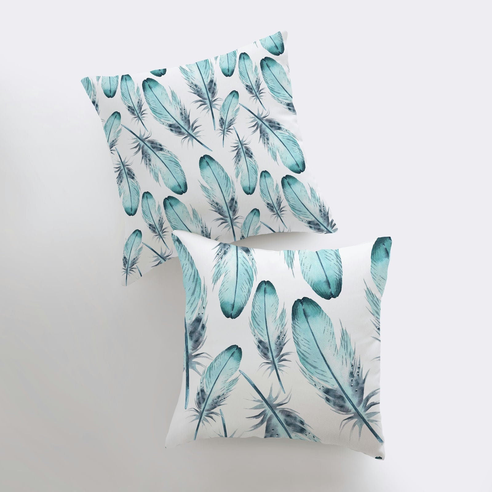 Light Blue Feathers Pillow Cover featuring a blue feather pattern on the front and a double-sided print on the back, handcrafted in America.