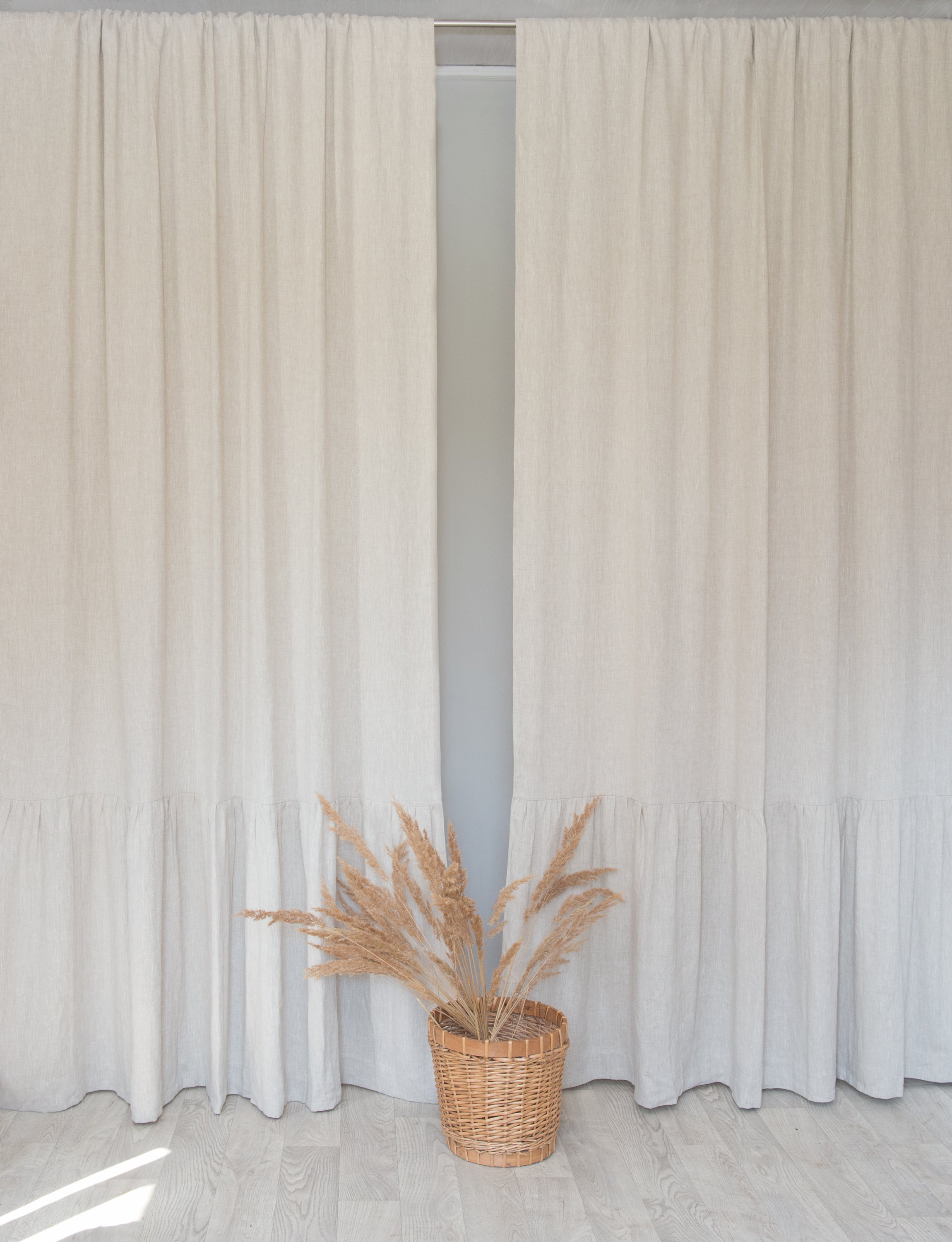 Light Grey linen curtain with ruffles and rod pocket, elegantly draped to showcase its texture and design.