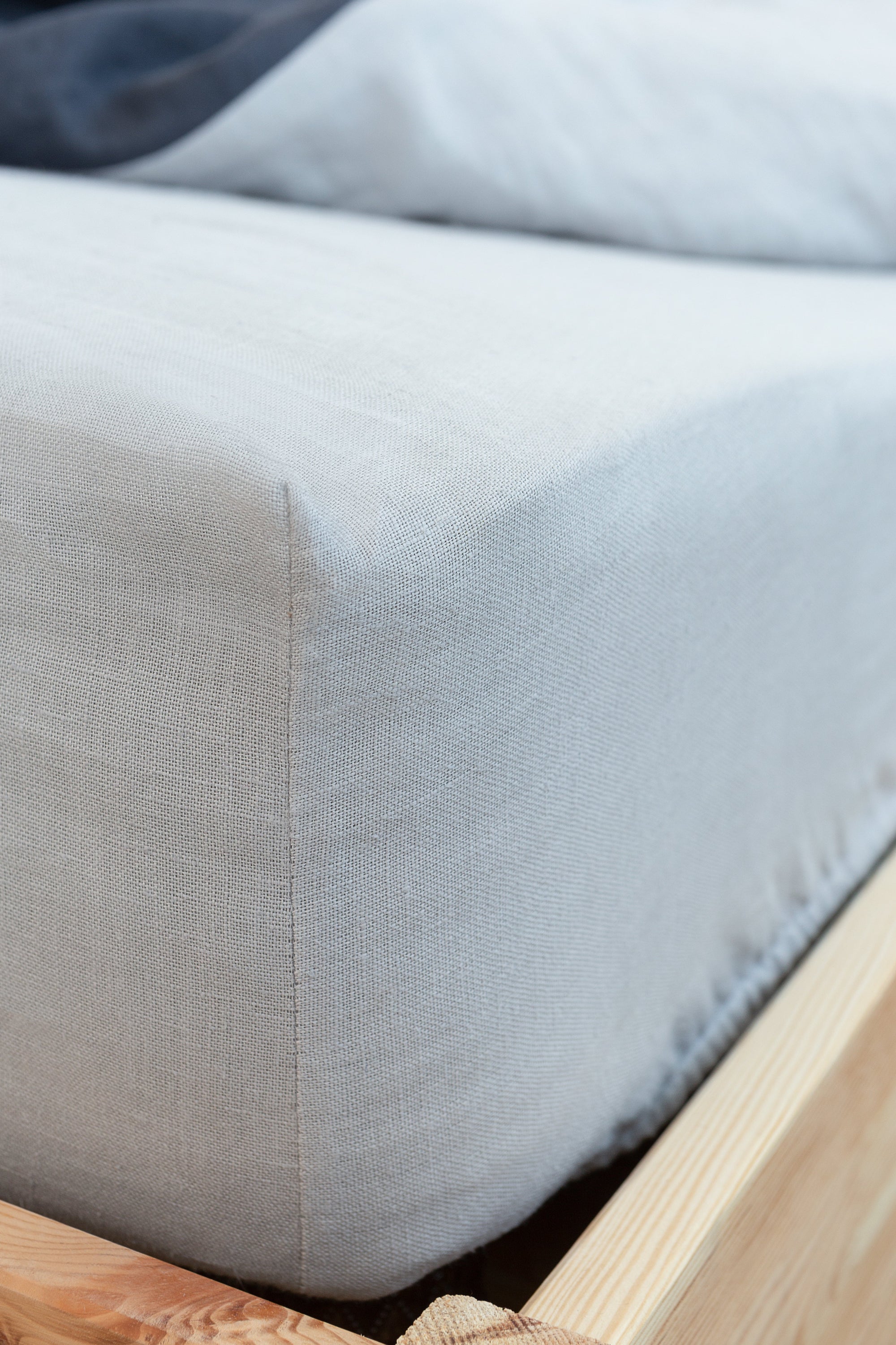 Light Grey linen fitted bedsheet made from 100% natural linen, showcasing its soft texture and elastic edges for a perfect fit.