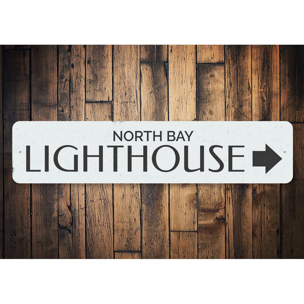 Lighthouse Arrow Sign made of high-quality aluminum, featuring customizable text and a coastal design, perfect for beach-themed decor.